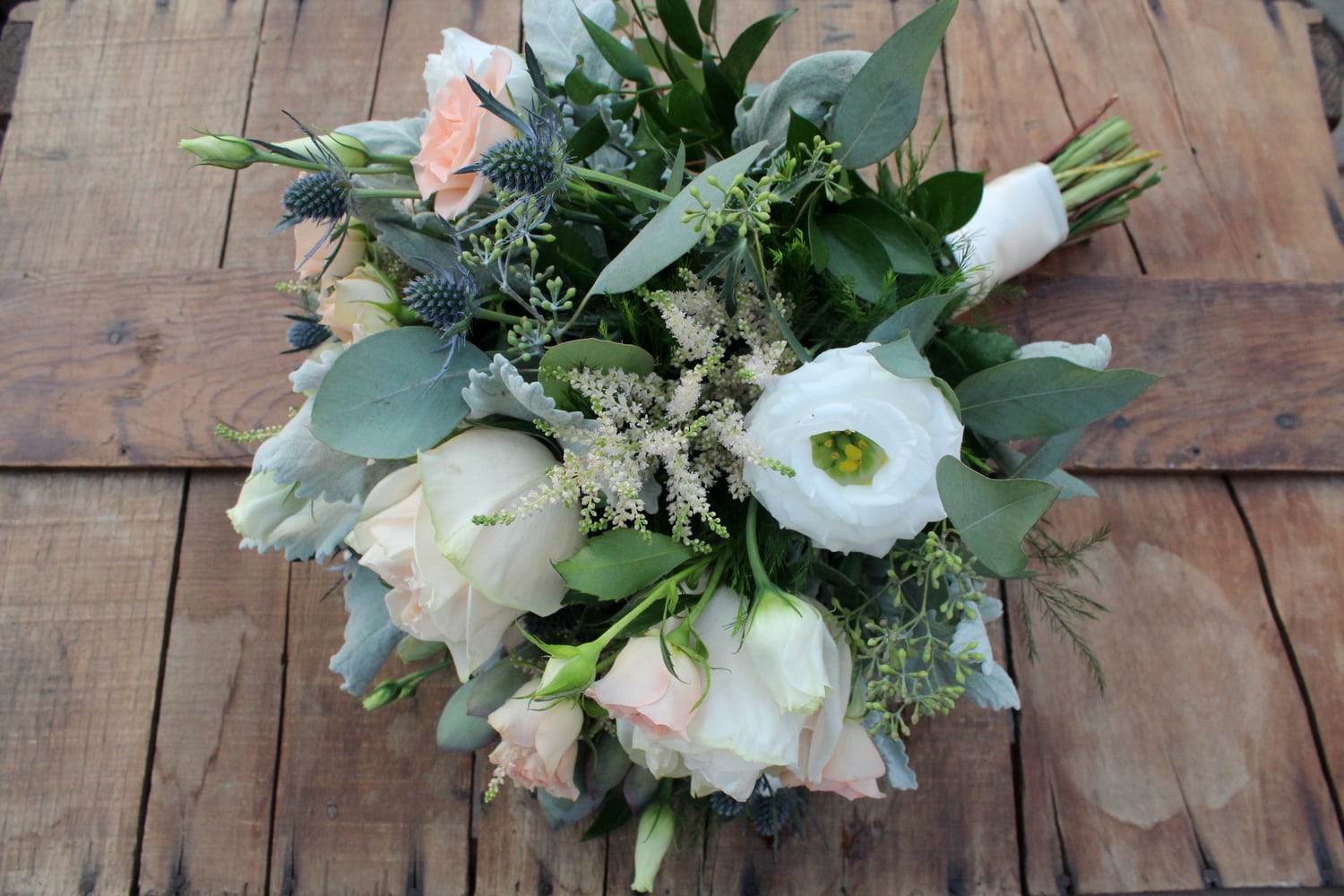 Pale pink and white hand-tied bouquet with silver foliage by Studley Flower Gardens
