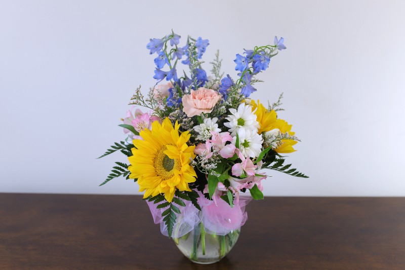 Carefree Moment Bouquet with pastel flowers and sunflowers by Studley Flower Gardens