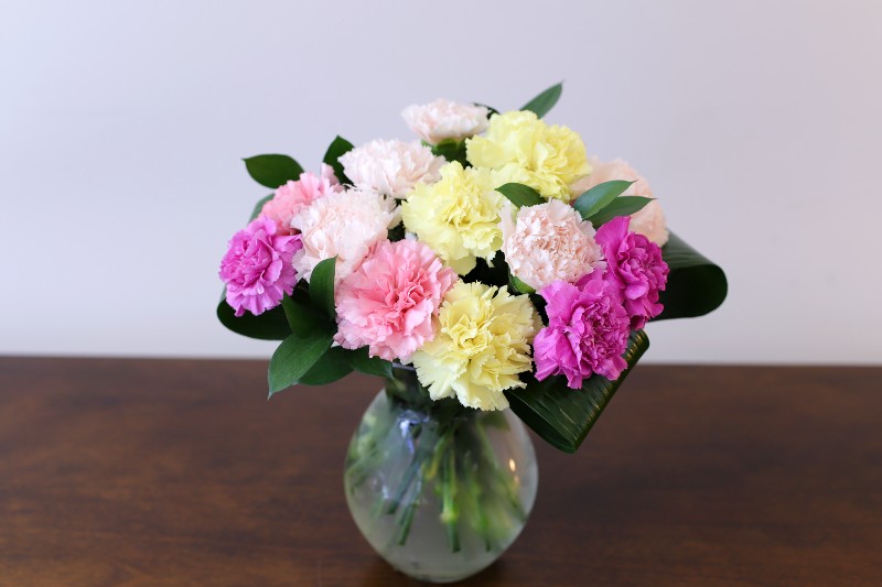 Pastel carnation bouquet with soft mixed blooms by Studley Flower Gardens