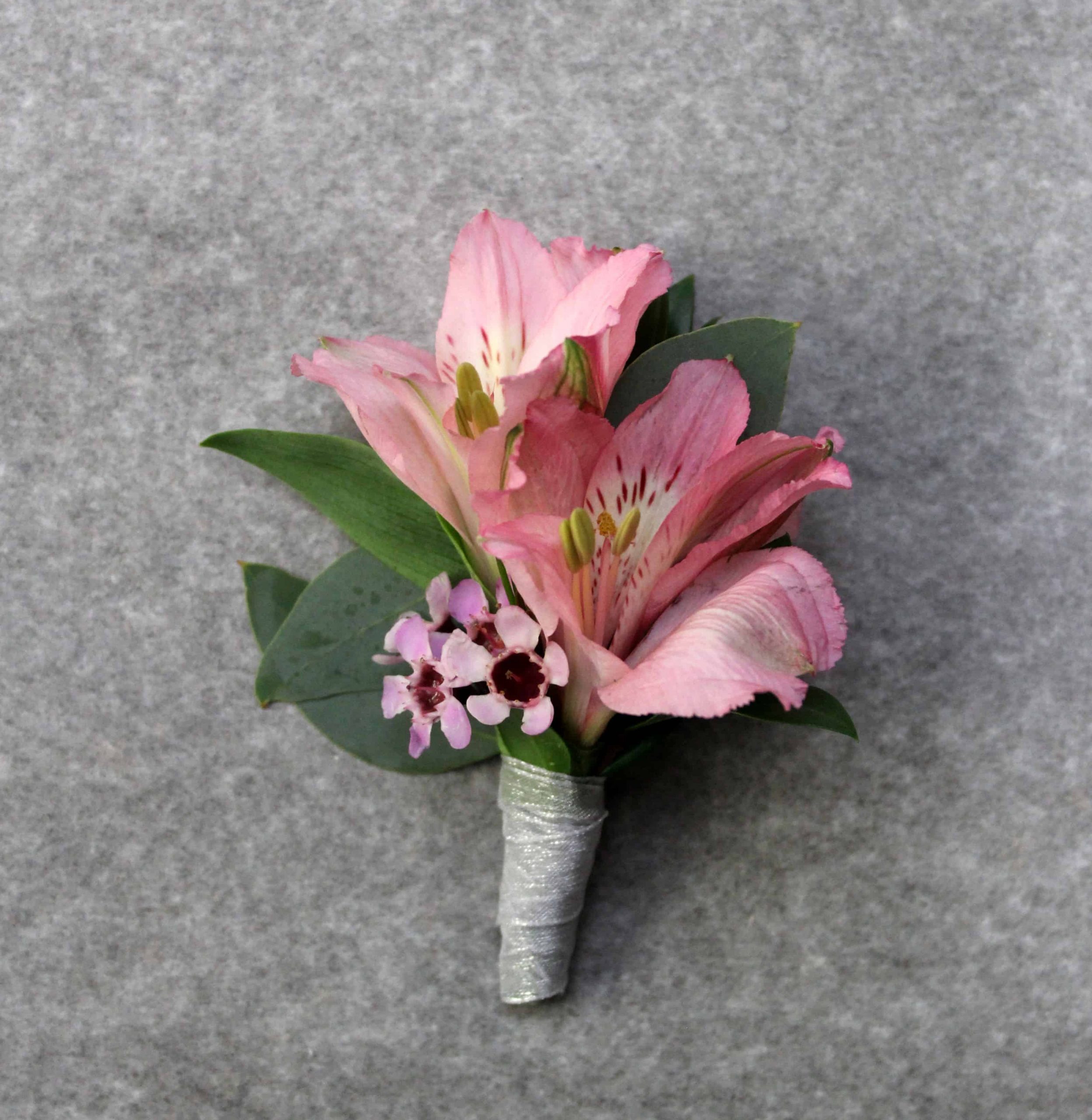 Colorful garden boutonniere with Peruvian lily and greenery by Studley Flower Gardens