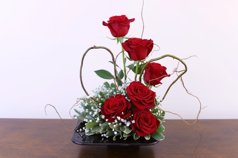 Heart of Gold Bouquet with red roses and willow heart by Studley Flower Gardens