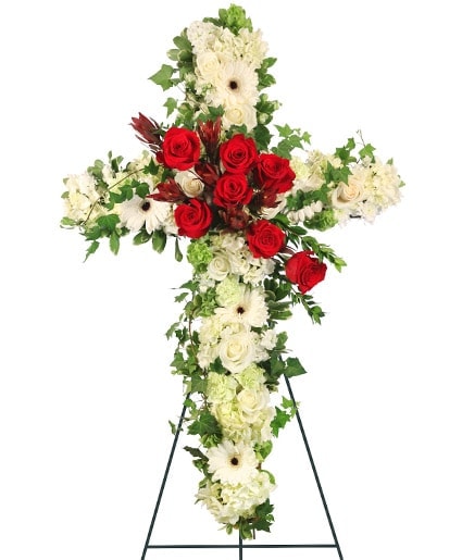 Red and white Peaceful Cross standing spray by Studley Flower Gardens