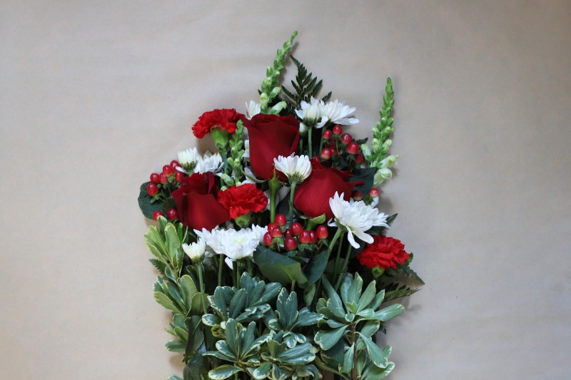 Scarlet Gems wrapped bouquet with red and white blooms by Studley Flower Gardens