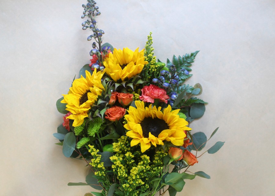 Tuscan Memory wrapped bouquet with sunflowers and spray roses by Studley Flower Gardens