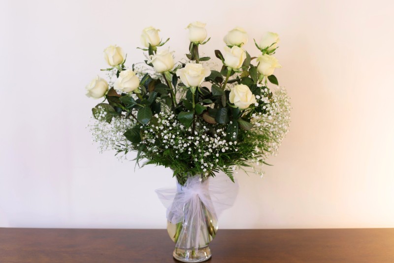White roses classic arrangement with baby’s breath by Studley Flower Gardens